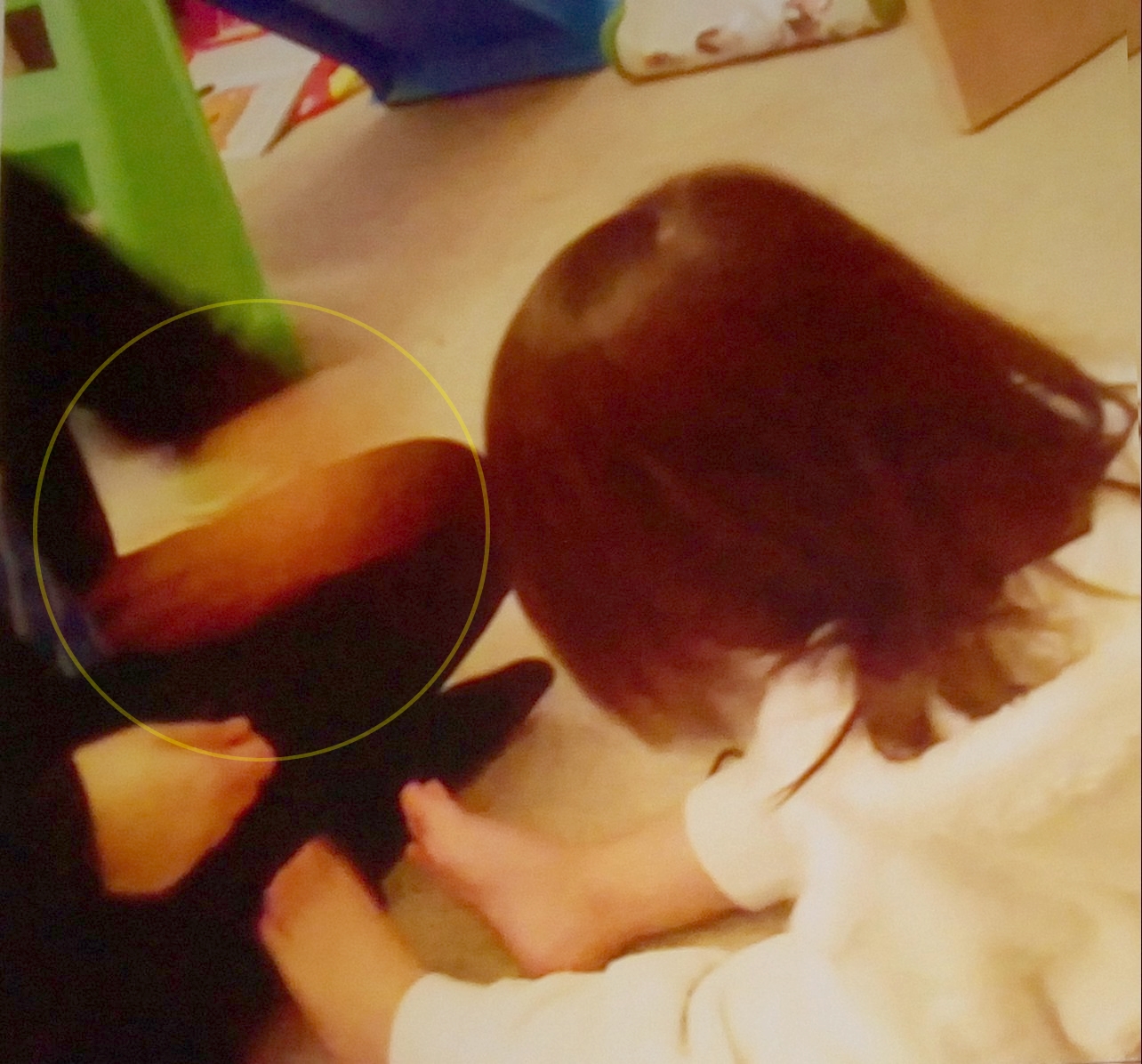 Ghostly hand on grandaughter's knee